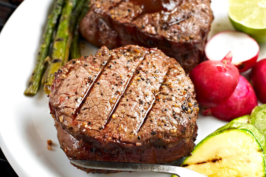 Close-Up 4K Ultra HD Image of Grilled Juicy Sirloin Steak with Potatoes in plate - Stock Photography