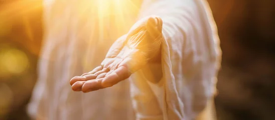 Foto op Plexiglas Jesus reaching out his hand against dark background Resurrected Jesus Christ reaching out hand and praying © shintartanya
