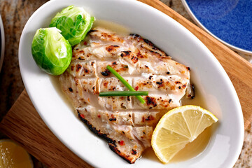 Close-Up 4K Ultra HD Image of Grilled Mahi with Lemon Sauce - Stock Photography