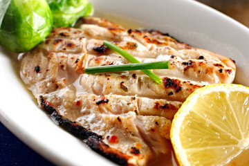 Close-Up 4K Ultra HD Image of Grilled Mahi with Lemon Sauce - Stock Photography