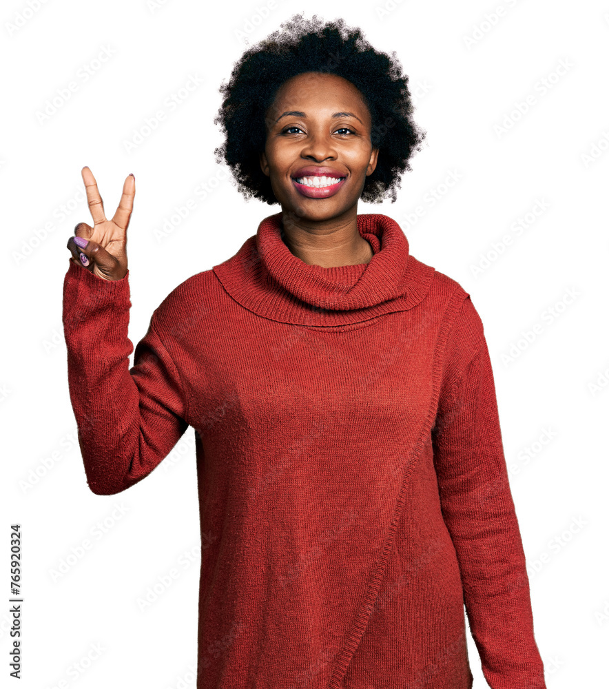 Canvas Prints african american woman with afro hair wearing turtleneck sweater smiling with happy face winking at 