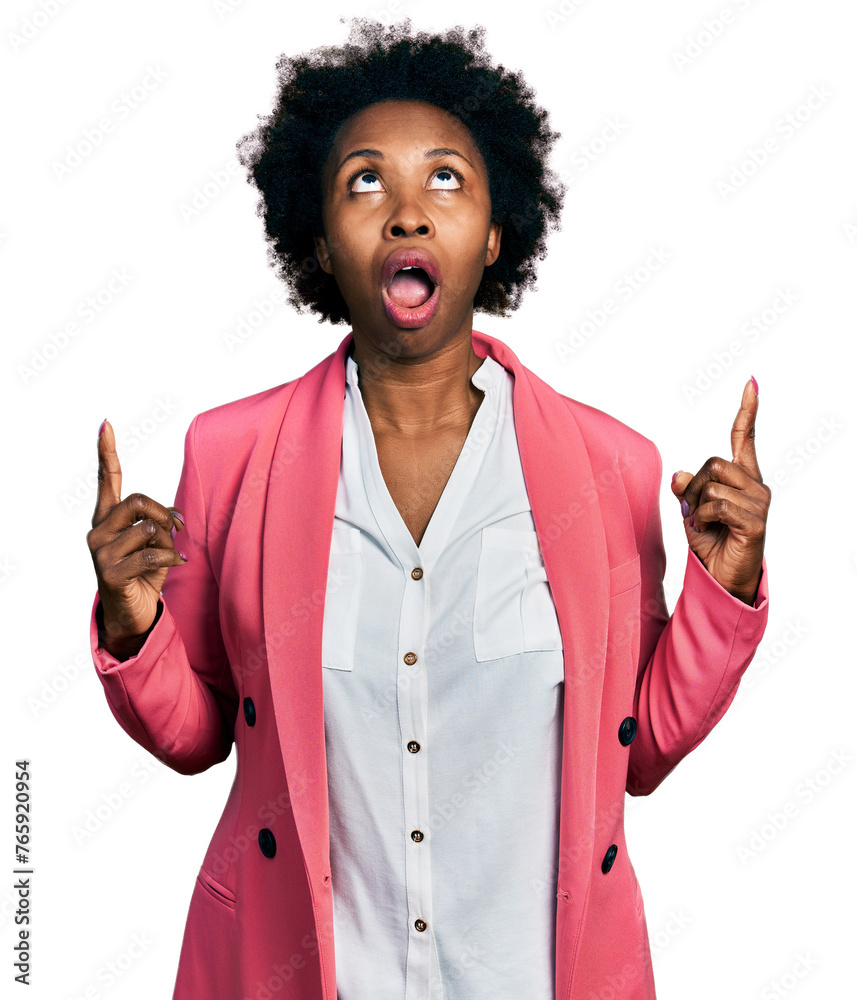 Wall mural african american woman with afro hair wearing business jacket amazed and surprised looking up and po