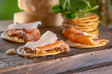 Close-Up 4K Ultra HD Image of Crackers with Smoked Salmon and Cheese - Stock Photography