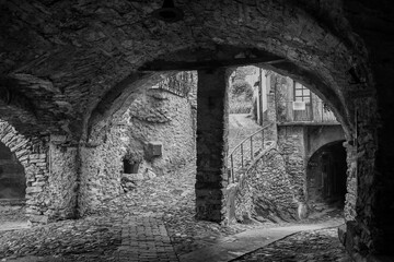 Black and white photo. Glimpse of the so-called "village of witches", famous for the witch trials dating back to 16th century, Triora, Imperia, Liguria, Italy