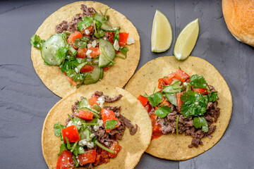 Close-Up 4K Ultra HD Image of Corn Tostada with Beef and Tomato - Stock Photography