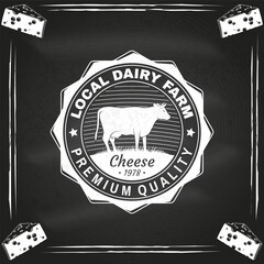 Local dairy farm badge design on the chalkboard. Template for logo, branding design with cow on the grass. Vector illustration. Hand crafted product cheese - 765925357