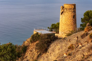 Selbstklebende Fototapeten Torre del pino, old watchtower in the Cliffs of Maro-Cerro Gordo Natural Park, Nerja, Malaga. © M. Perfectti