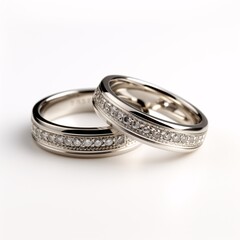 a pair of silver rings with diamonds