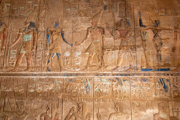 Remnants of Painted Ceremonial Carvings of Pharaohs on the Walls of the Karnak Temple Complex, Luxor, Egypt - 765934123