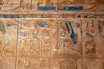 Remnants of Brilliantly Painted Blue Ceremonial Hieroglyphs and Carvings of Pharaohs on the Walls of the Karnak Temple Complex, Luxor, Egypt - 765934354