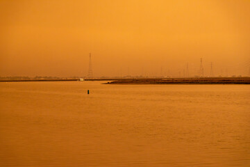 California Westpoint Slough on San Francisco Bay, California; Orange Smoke Filled Skies from Nearby Out of Control Wildfires Caused by Drought and Climate Change - 765935547