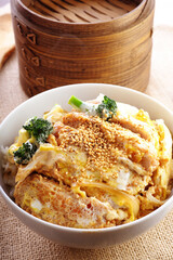 Close-Up 4K Ultra HD Image of Katsudon (Pork Cutlet) Over Steamed Rice - Japanese Cuisine