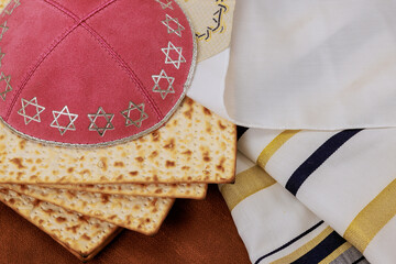Jewish traditional ritual with Passover unleavened bread Matzah Pesach celebration symbol kippah,...