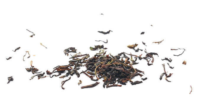 Heap Darjeeling Tea dried tea leaves isolated on white, close up, side view 