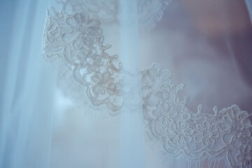 Close up of lace embroidery on tulle bridal veil
