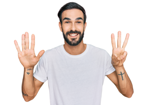 Young hispanic man wearing casual white t shirt showing and pointing up with fingers number eight while smiling confident and happy.