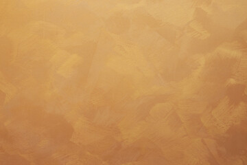 Textured orange brown golden wall background plastered surface. Graphic vintage background backdrop