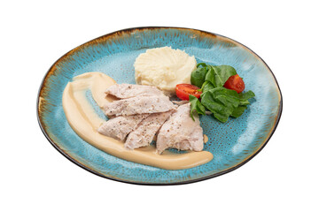 chicken with mashed potatoes and greens on an isolated white background in a plate