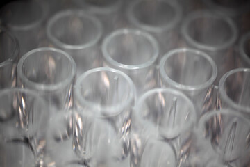 Close-up of a transparent plastic 96-well plate used for luminescence measurement in biology -...