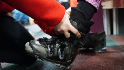 Ski boots lined up in ski equipment store