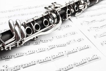 Clarinet woodwind instrument with sheet music. - 765961346