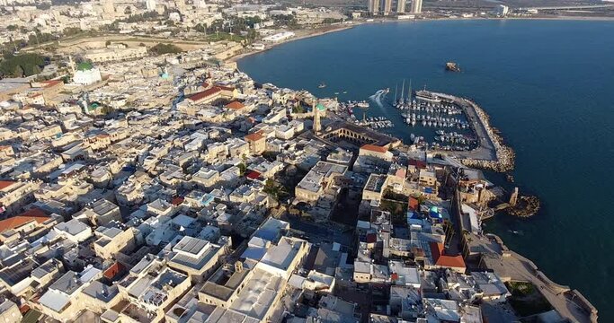 Panoramic Aerial View of Acco, Acre, Akko old city with crusader palace, city walls, arab market, knights hall, crusader tunnels, in Israel. Green Roof Al Jazzar Mosque