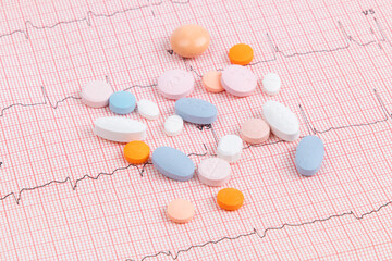 a variety of pills and tablets pills used for hypertension and heart disease treatment spilled out...