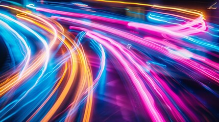 Colorful light streaks in motion for dynamic background. Vivid abstract light patterns captured in long exposure photography. Dynamic and vibrant light trails as creative background art.