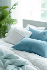 A cozy and inviting bedroom featuring a bed dressed in teal bedding with accent pillows, all illuminated by natural light from a nearby window. Organic cotton bed linen
