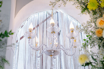 hanging lamps and flower arrangements