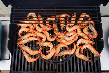 Cooking shrimp on the barbecue grill - 765993900