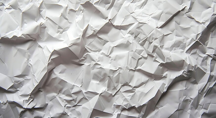 Background of a blank sheet of wrinkled paper for use in design.