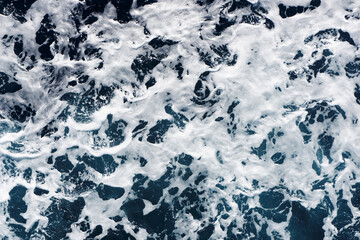 Ocean wave background. Bubble water backdrop. Turbulent sea texture. Messy water flow. Depth of the sea. Water foam surface backdrop. Rapid river flow.