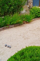 Playing a game of boules bocce ball (also called pétanque) in Provence, France - 765994105