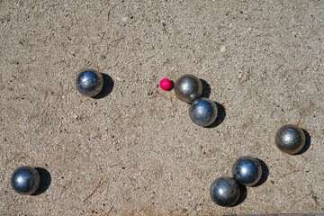 Playing a game of boules bocce ball (also called pétanque) in Provence, France - 765994130