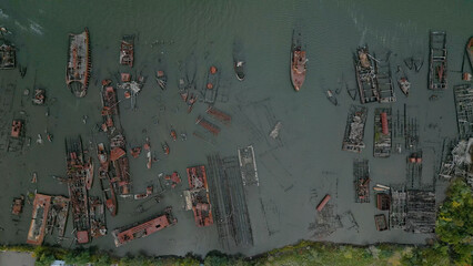 Remains of ship vessels disintegrating in harbor