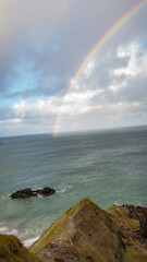 Rainbow over the sea near Sango Bay beach at Durness, northwest Scottish Highlands. mobile wallpaper portrait.