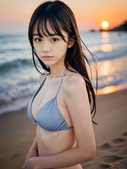 夏の夕暮れのビーチでビキニの水着を着た若い女性