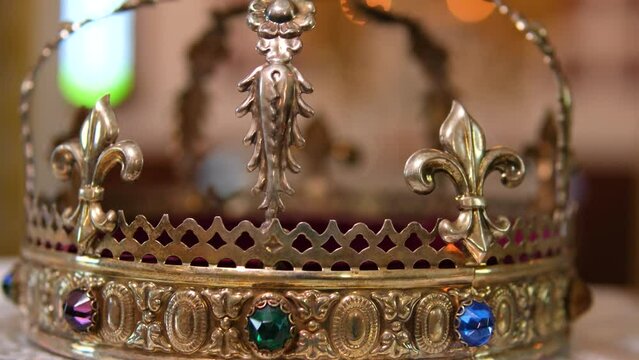 Church attributes for wedding ceremony. Gold crowns are on the altar. Attributes of priest. Interior of church
