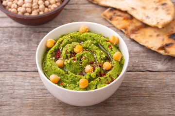 Declicious food from chickpea - green hummus. - 766023970