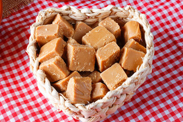diced caramel candy in basket. Traditional sweet from Brazilian country festivals