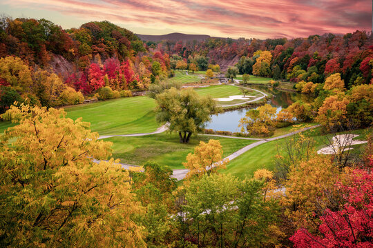 Aerial View of a Golf Course in Fall Foliage, autumn golf course