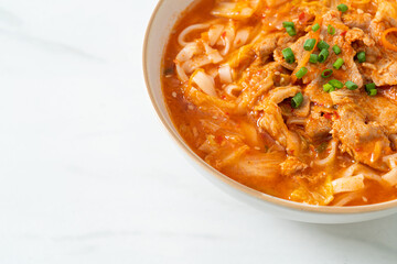 Korean udon ramen noodles with pork in kimchi soup
