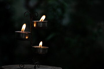 Candle flame on natural background.
