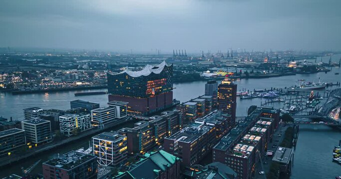 4K Aerial view Hyper lapse Footage of above Hamburg Cityscape at evening time, Germany, Tourism and Travel Destination a major port city in northern Germany