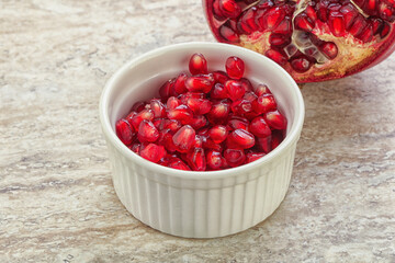 Ripe red Pomegranate seeds in the bowl