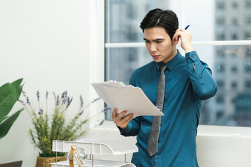 Image of Asian male businessman working in the office