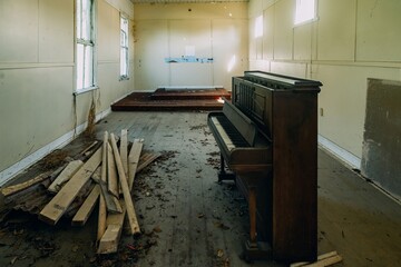 Interior of an abandoned church with a piano. Bay of Plenty, New Zealand.