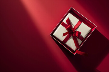 Blank white gift box open or top view of white present box tied with red ribbon bow isolated on dark red background. Generative AI