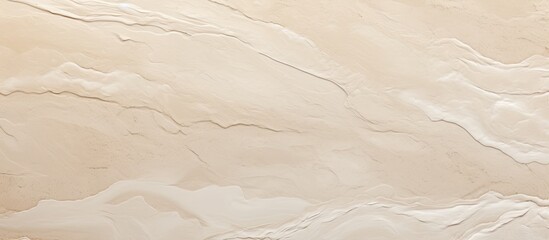 Obraz premium A close up of a rectangle paper product with a marble texture in beige tones, resembling a landscape of cumulus clouds. The flooring looks like wood or plaster